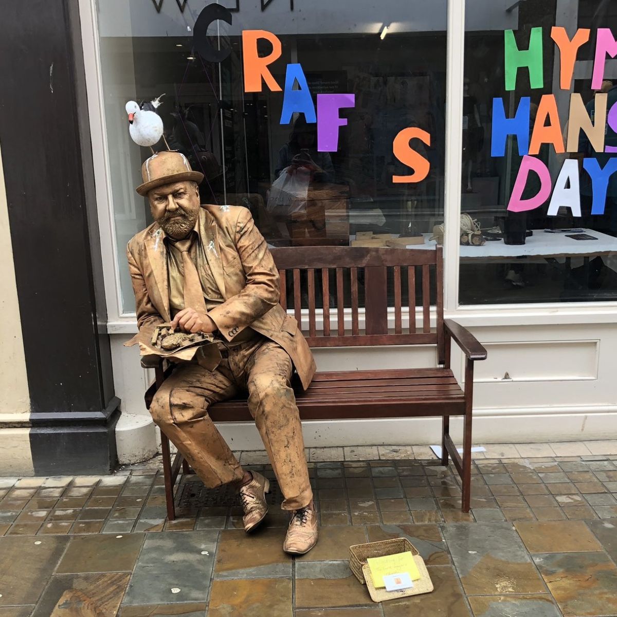 Hull's well known Gold Man human statue entertains the crowd at Hanse day