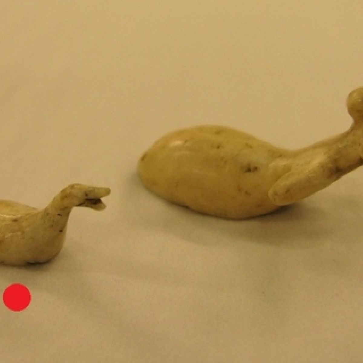 Two Bird Figures Carved From Bone