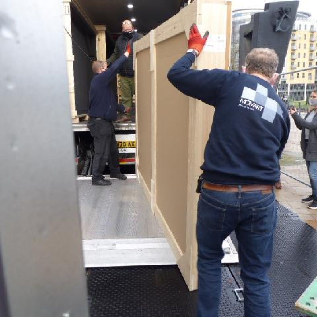 Lifting The Paintings In Place On The Lorry