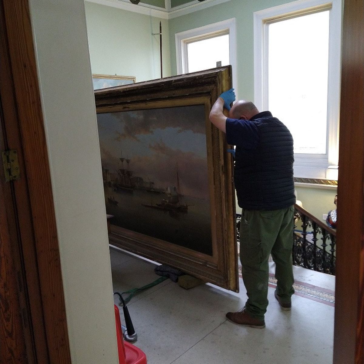 Moving The Painting To Be Packed