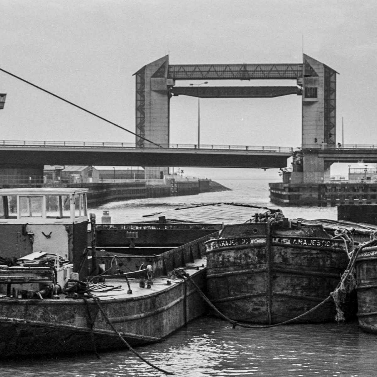 Barges Moored On The River Hull At Myton Bridge And The Tidal Barrier In The Background And Sammys Point Clearly Seen Before The Deep Was Built
