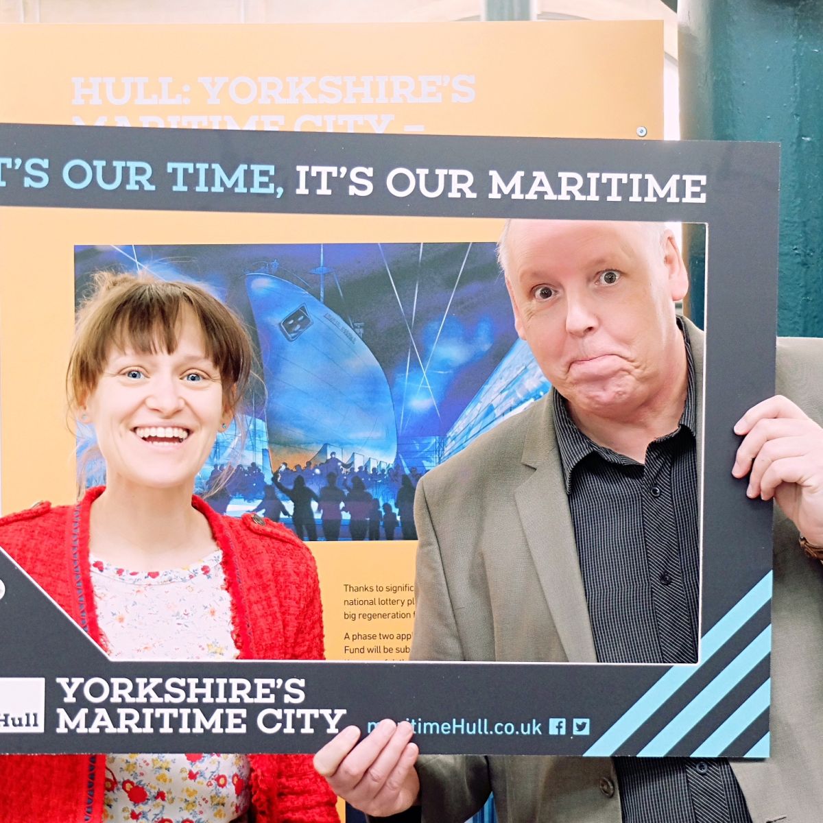 Exhibition specialists pose in the maritime selfie frame